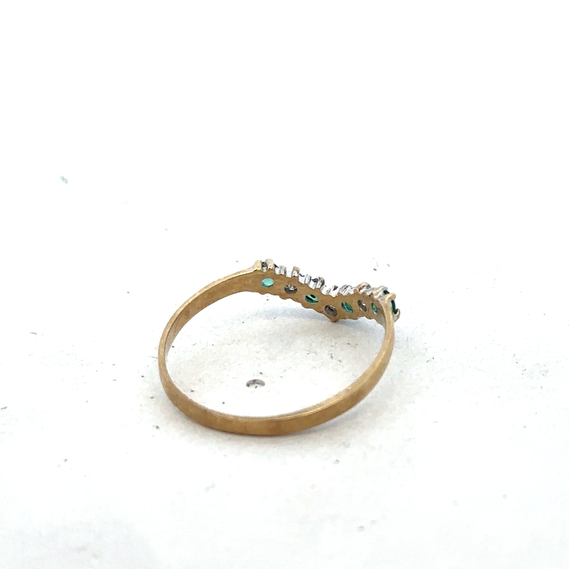 9ct yellow gold emerald and diamond ring, size O1/2, featuring a detailed Reeves and Sons design with sparkling gemstones.