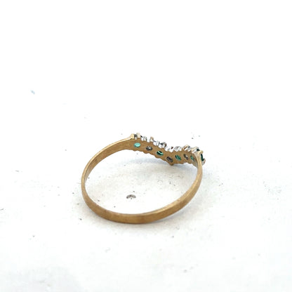 9ct yellow gold emerald and diamond ring, size O1/2, featuring a detailed Reeves and Sons design with sparkling gemstones.