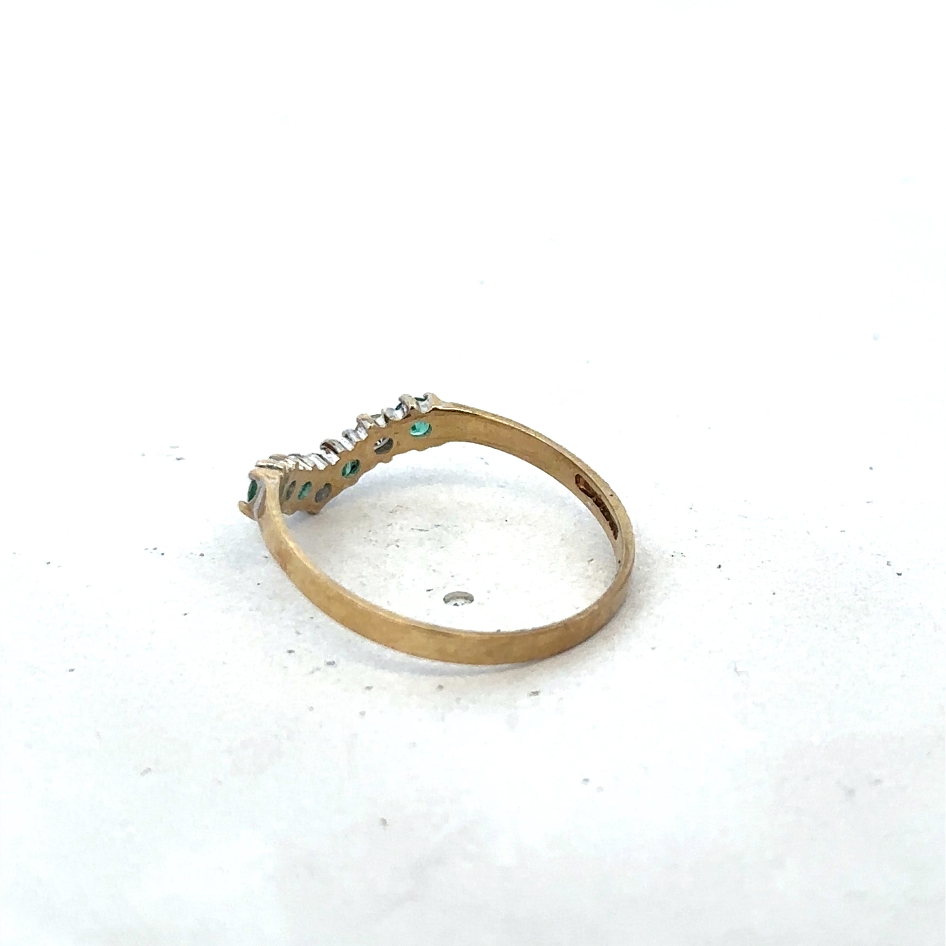 9ct yellow gold emerald and diamond ring with intricate design, size O1/2, by Reeves and Sons, showcasing elegant craftsmanship.