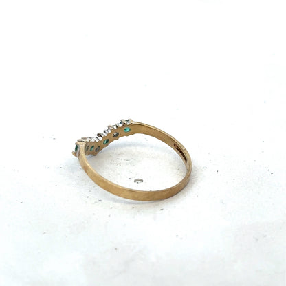 9ct yellow gold emerald and diamond ring with intricate design, size O1/2, by Reeves and Sons, showcasing elegant craftsmanship.