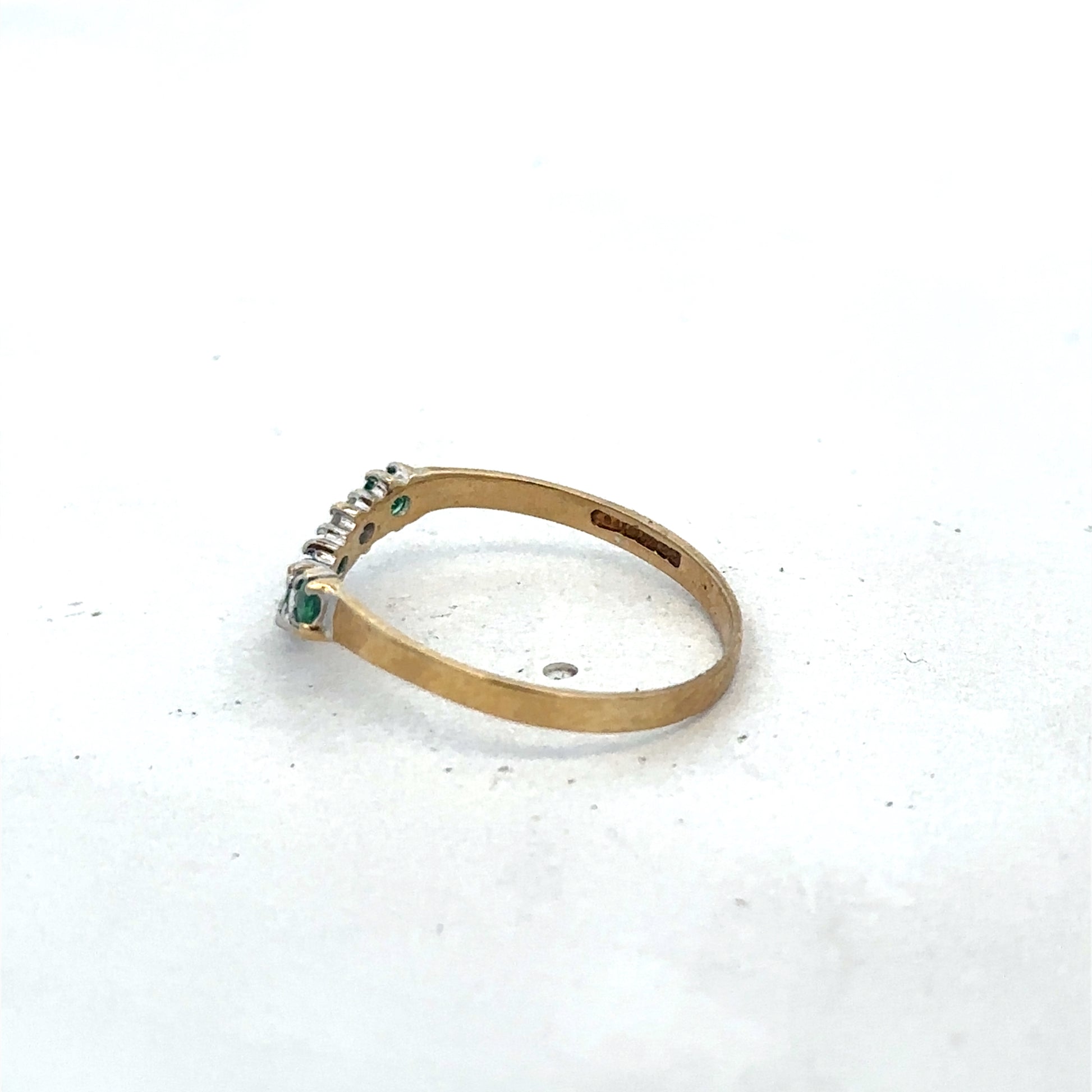 9ct yellow gold emerald and diamond ring by Reeves and Sons, size O1/2, featuring intricate gemstone settings and elegant design.