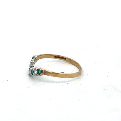9ct yellow gold emerald and diamond ring featuring a central emerald and surrounding diamonds, size O1/2, by Reeves and Sons.