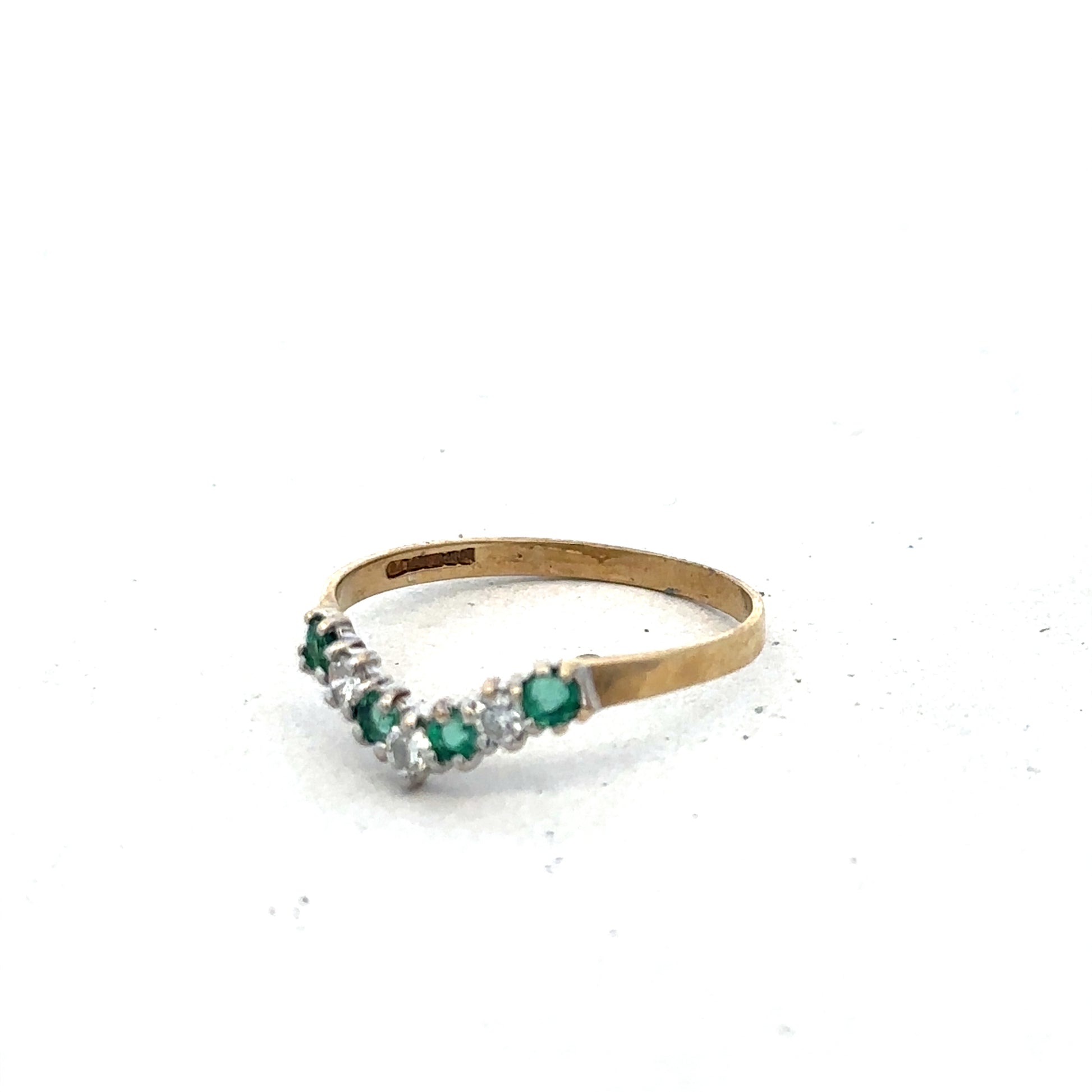 9ct yellow gold emerald and diamond ring by Reeves and Sons, size O1/2, featuring a detailed gemstone and gold band design