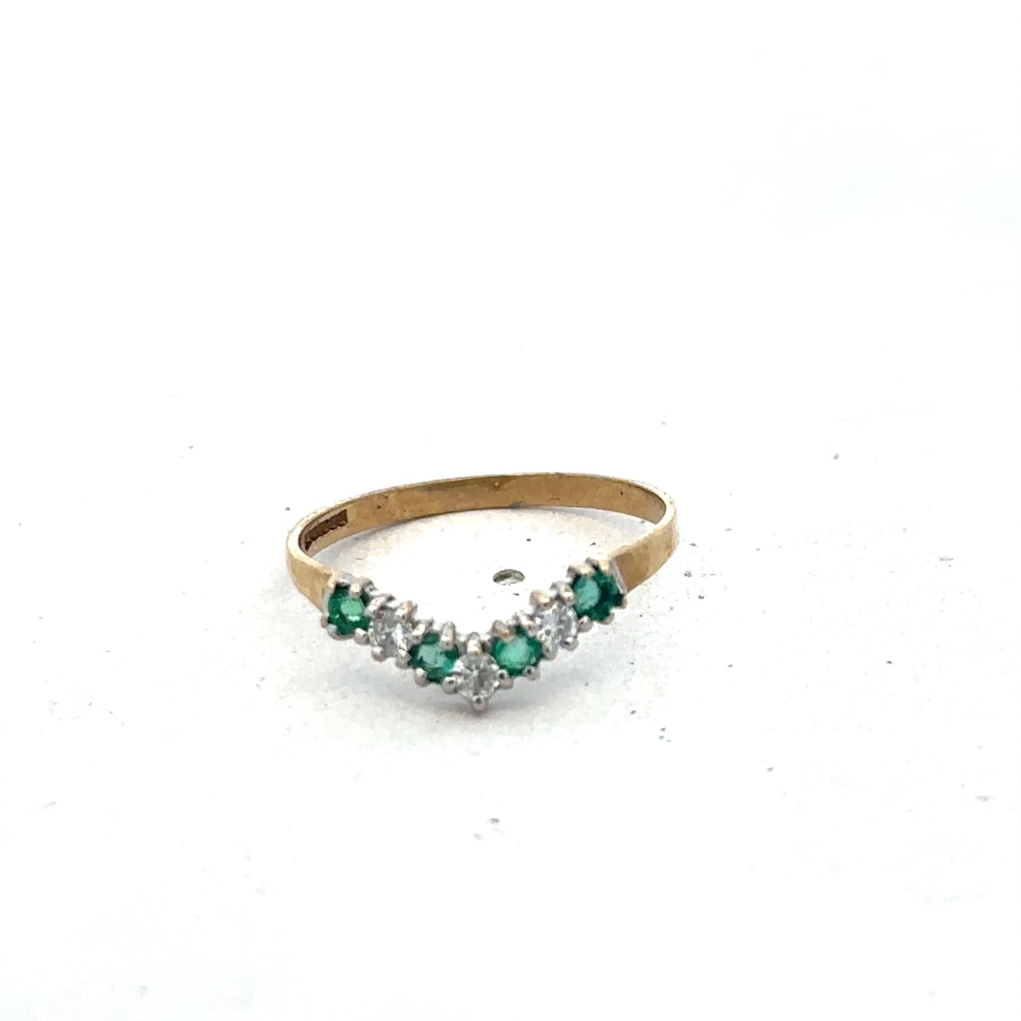 9ct yellow gold emerald and diamond ring with intricate band design, size O1/2, by Reeves and Sons.