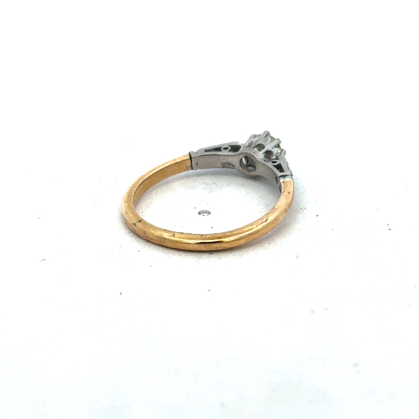 18ct yellow gold diamond ring by Reeves and Sons, size O, featuring sparkling diamonds on a polished band.