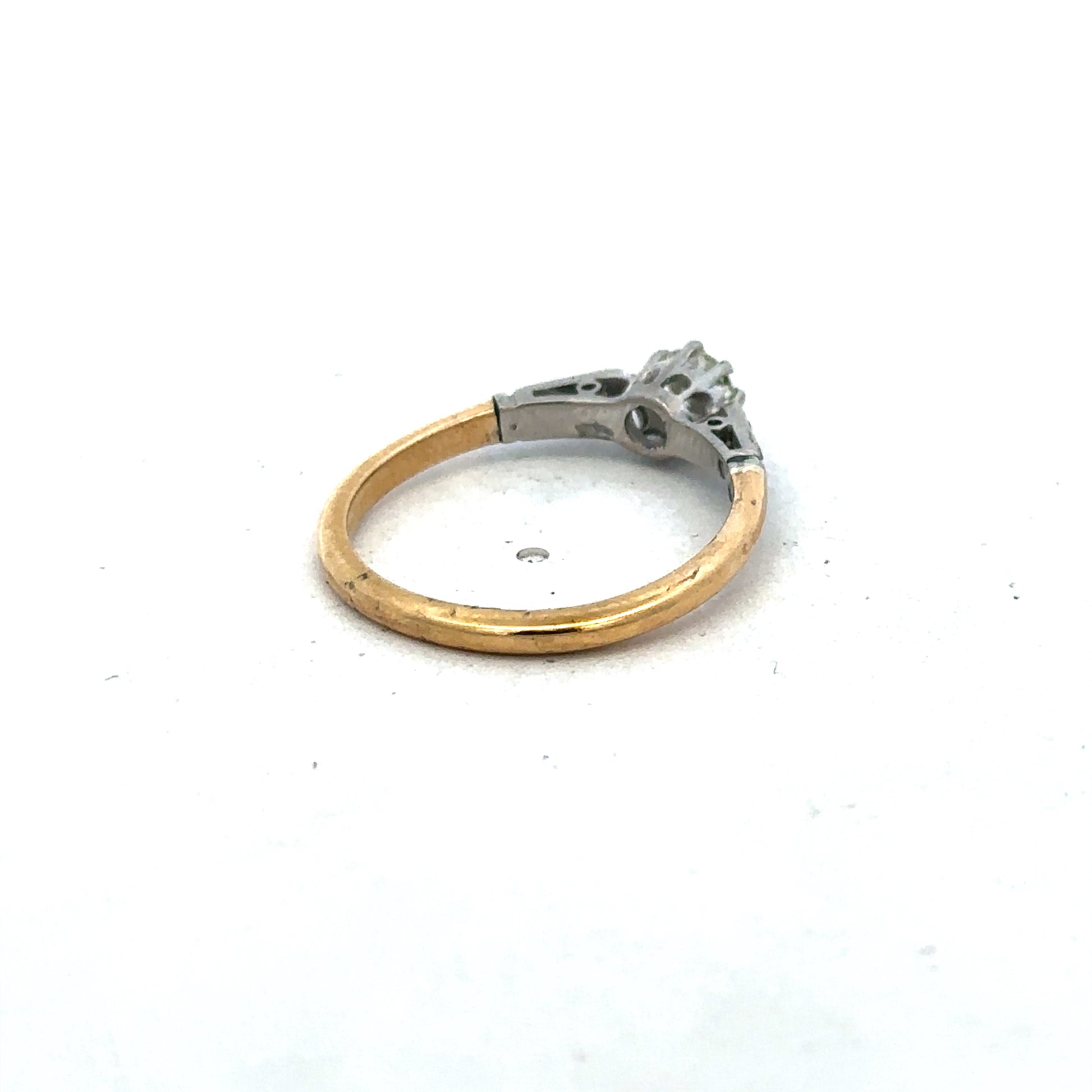 18ct yellow gold diamond ring by Reeves and Sons, size O, featuring sparkling diamonds on a polished band.