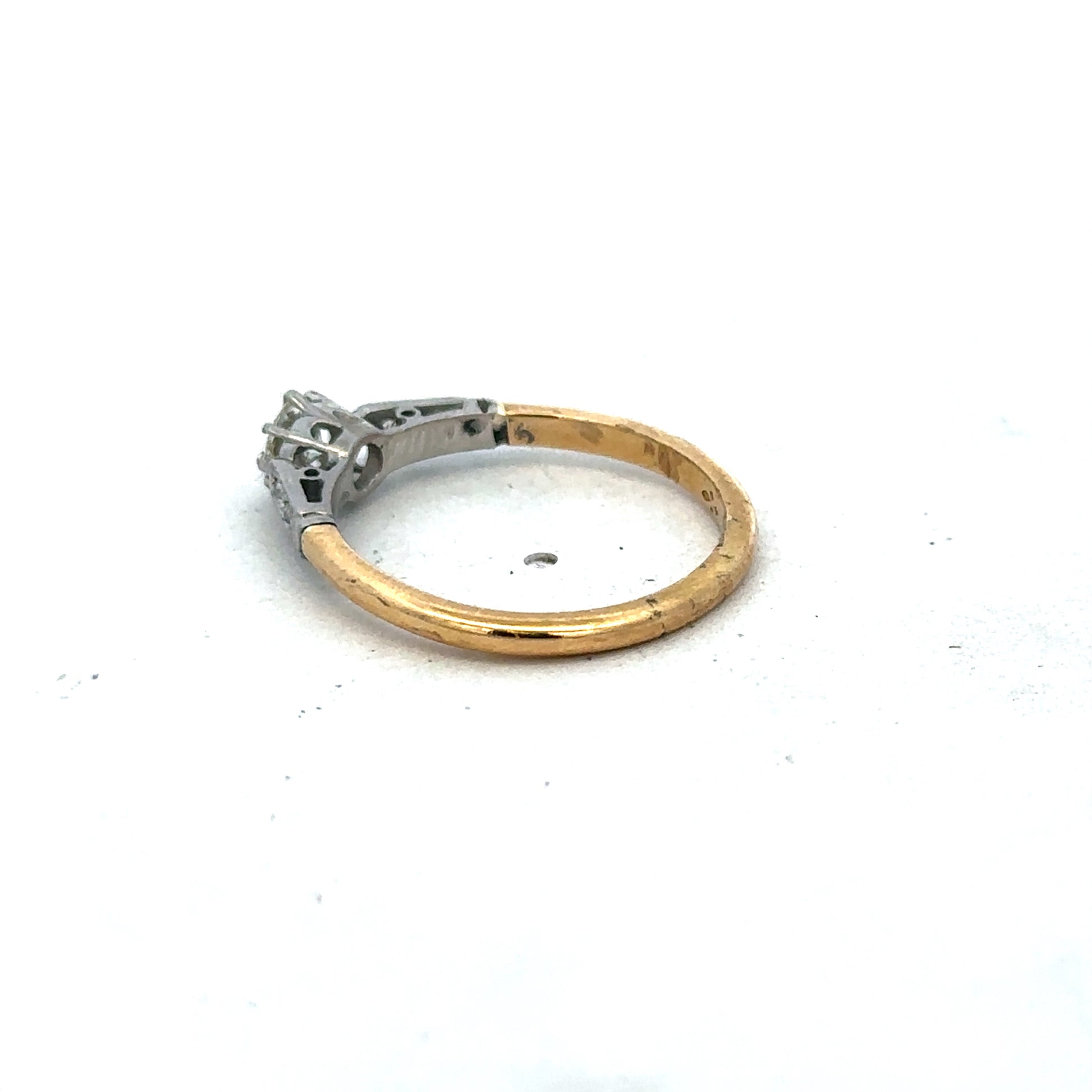 18ct yellow gold diamond ring size O by Reeves and Sons, featuring a sparkling diamond centerpiece.
