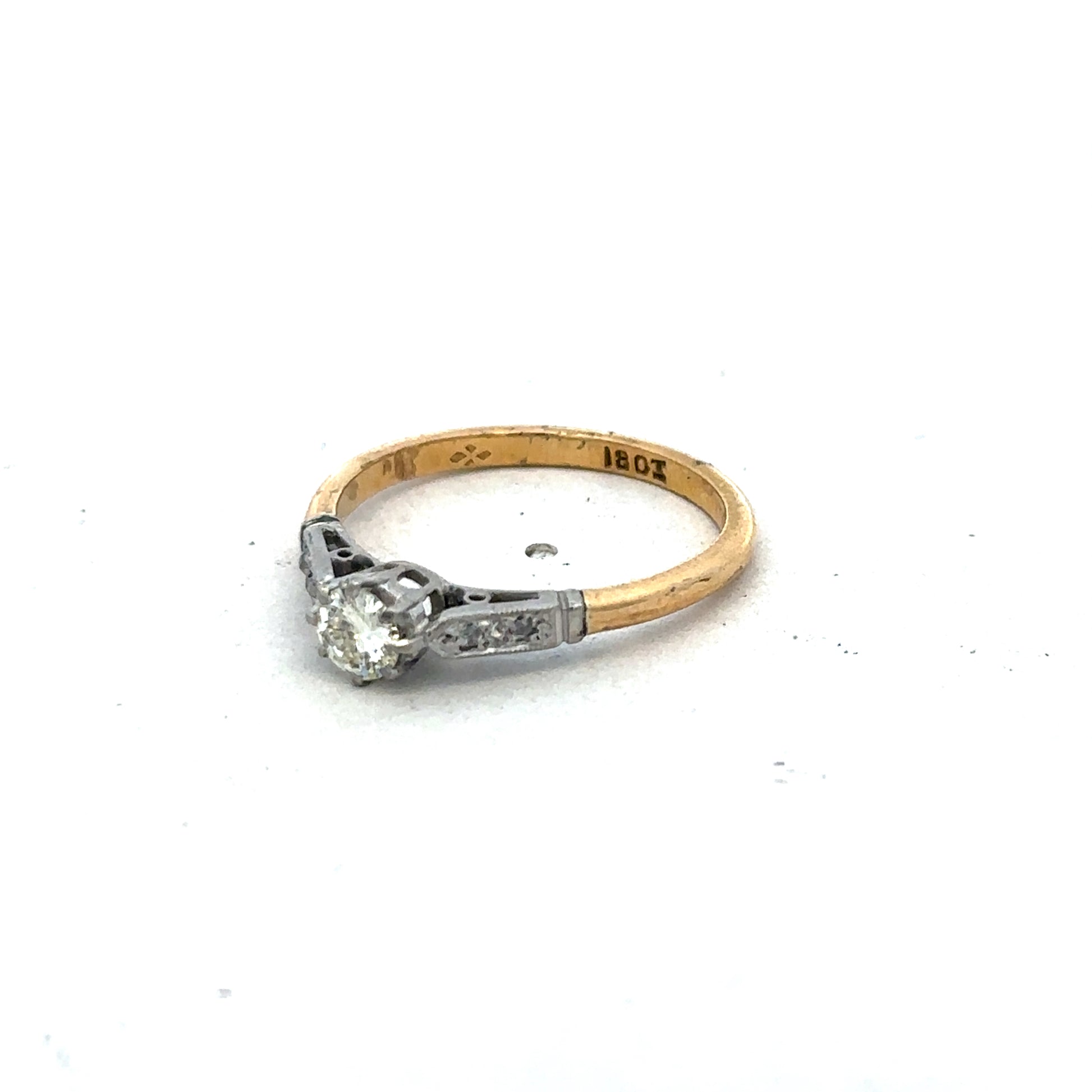 18ct yellow gold diamond ring in size O by Reeves and Sons, featuring a sparkling diamond design.