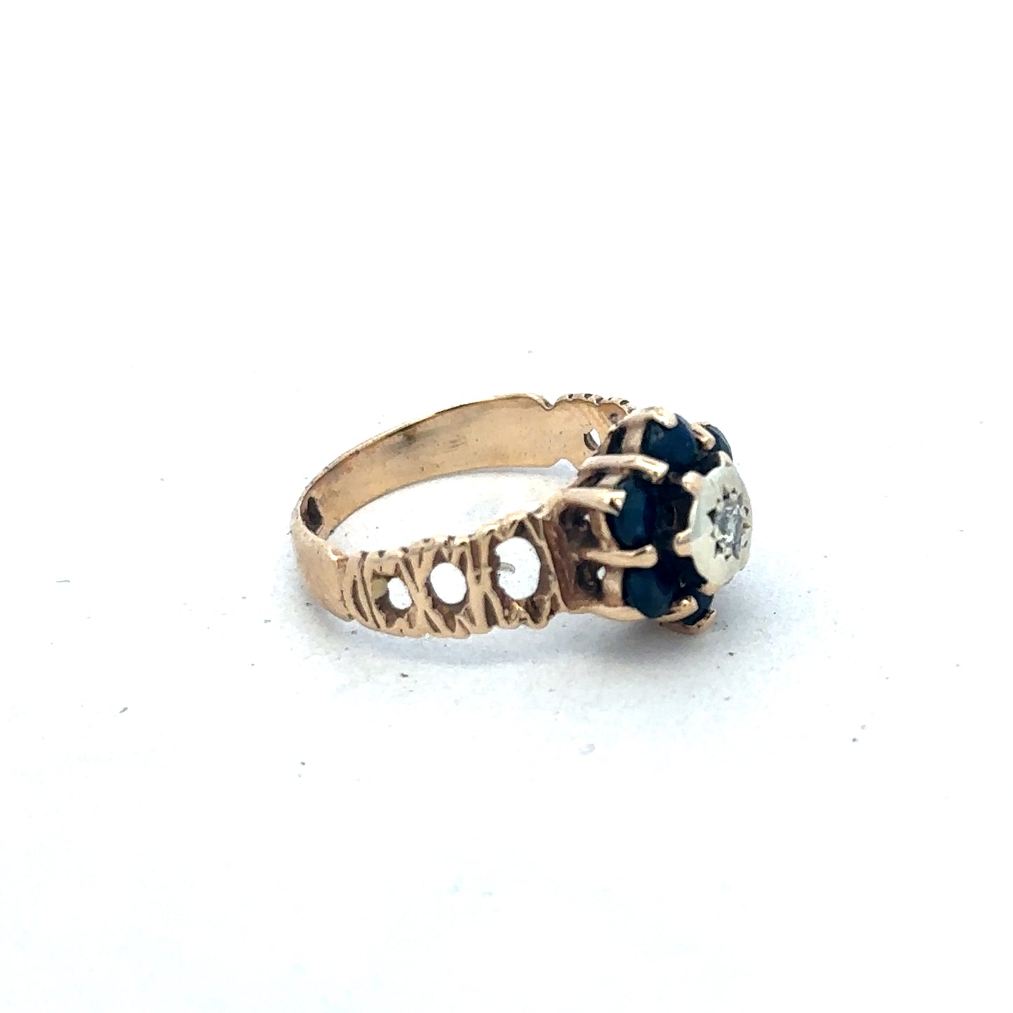 9ct yellow gold sapphire and diamond ring, size M, with intricate band design by Reeves and Sons.