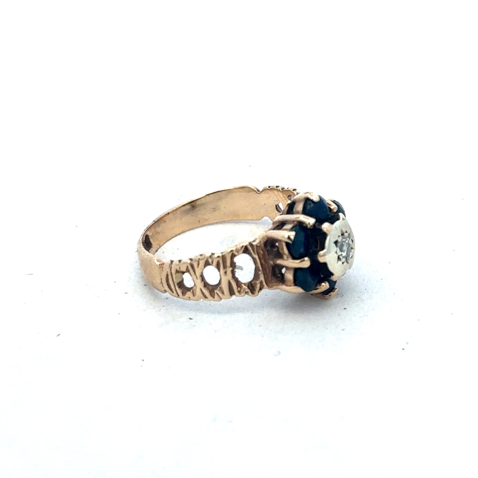 9ct yellow gold sapphire and diamond ring, size M, with intricate band design by Reeves and Sons.