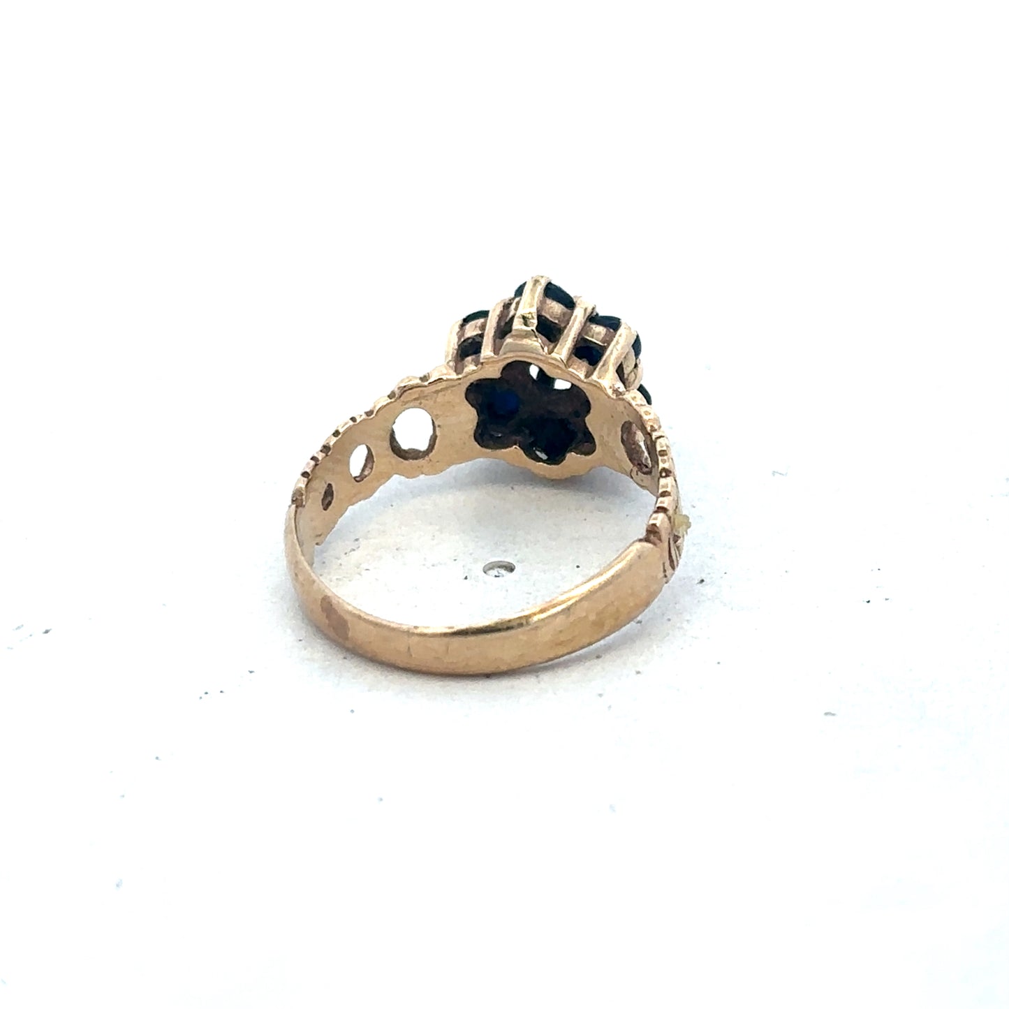 9ct yellow gold sapphire and diamond ring, size M, featuring a central sapphire with surrounding diamonds, by Reeves and Sons.