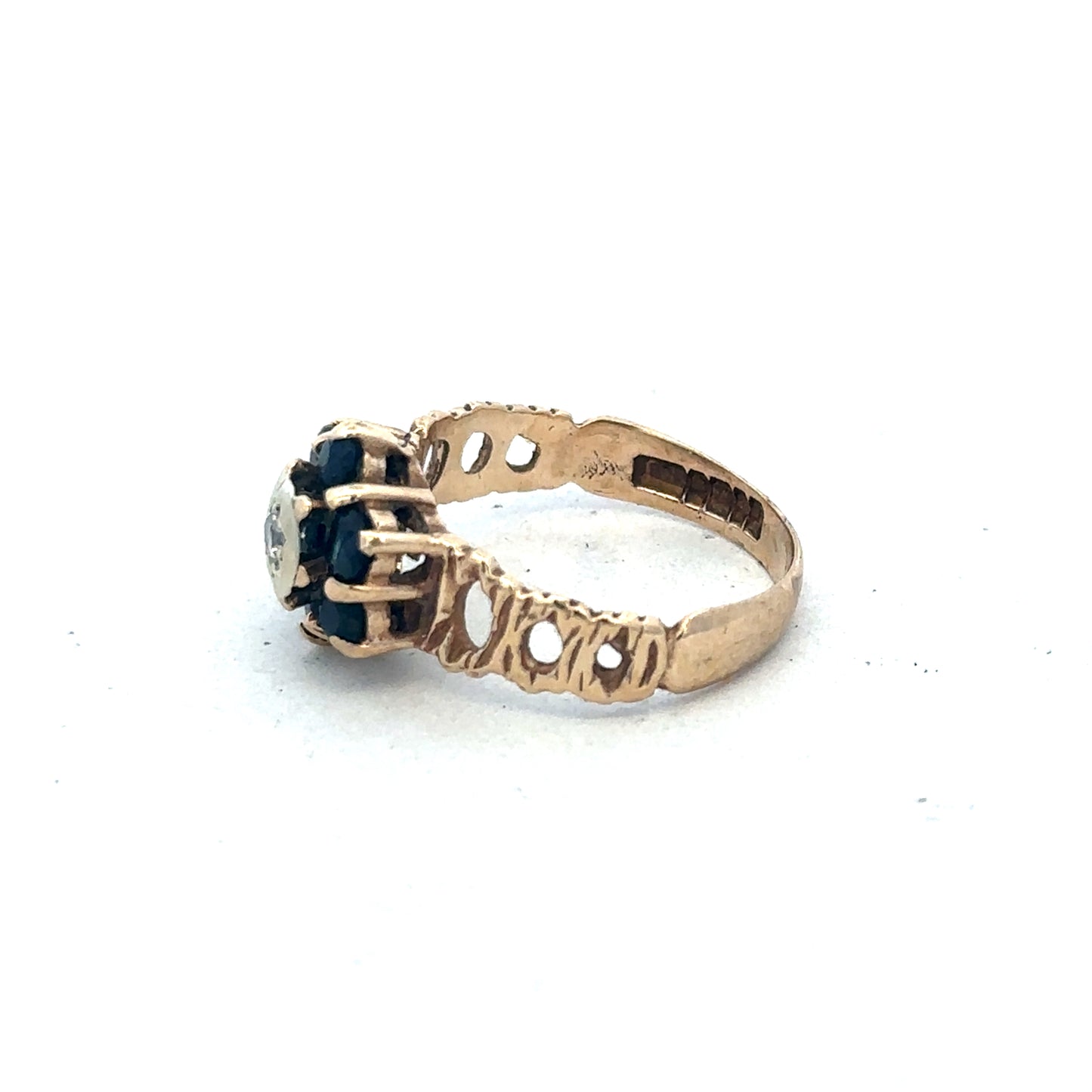 9ct yellow gold sapphire and diamond ring in size M with intricate band design, crafted by Reeves and Sons.