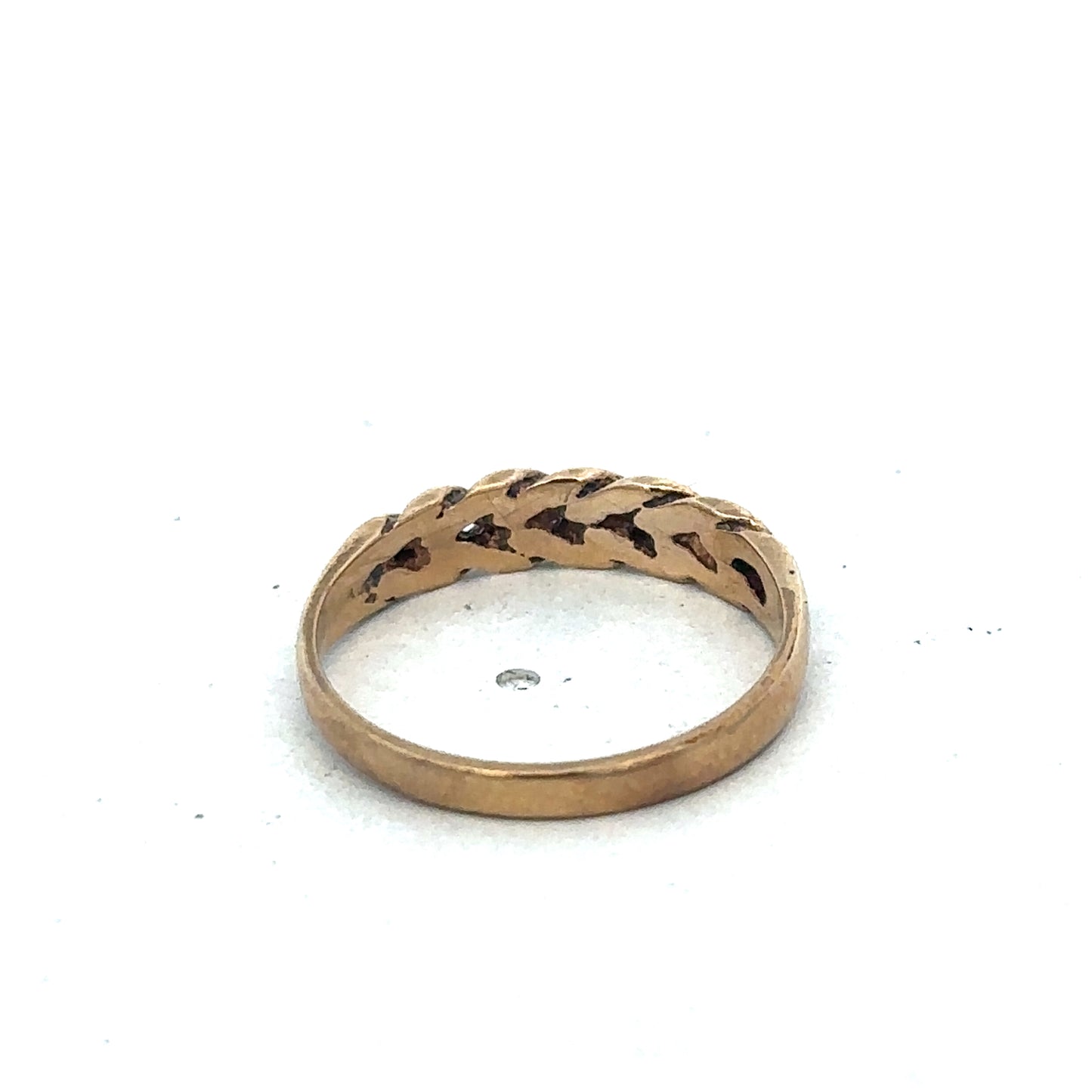 9ct yellow gold keeper ring size K by Reeves and Sons, showing a polished gold band with detailed craftsmanship.
