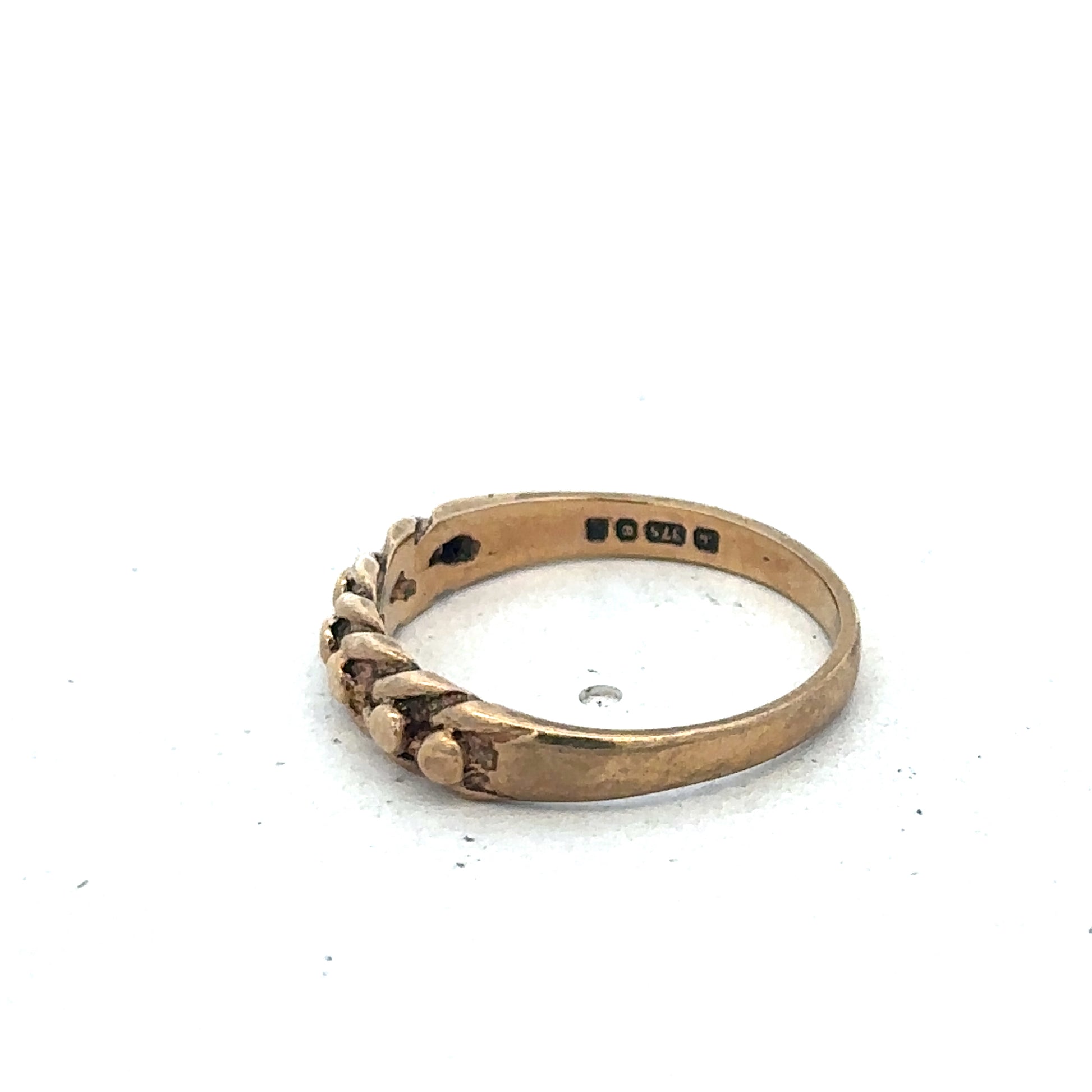 9ct yellow gold keeper ring in size K with a polished finish, designed by Reeves and Sons.