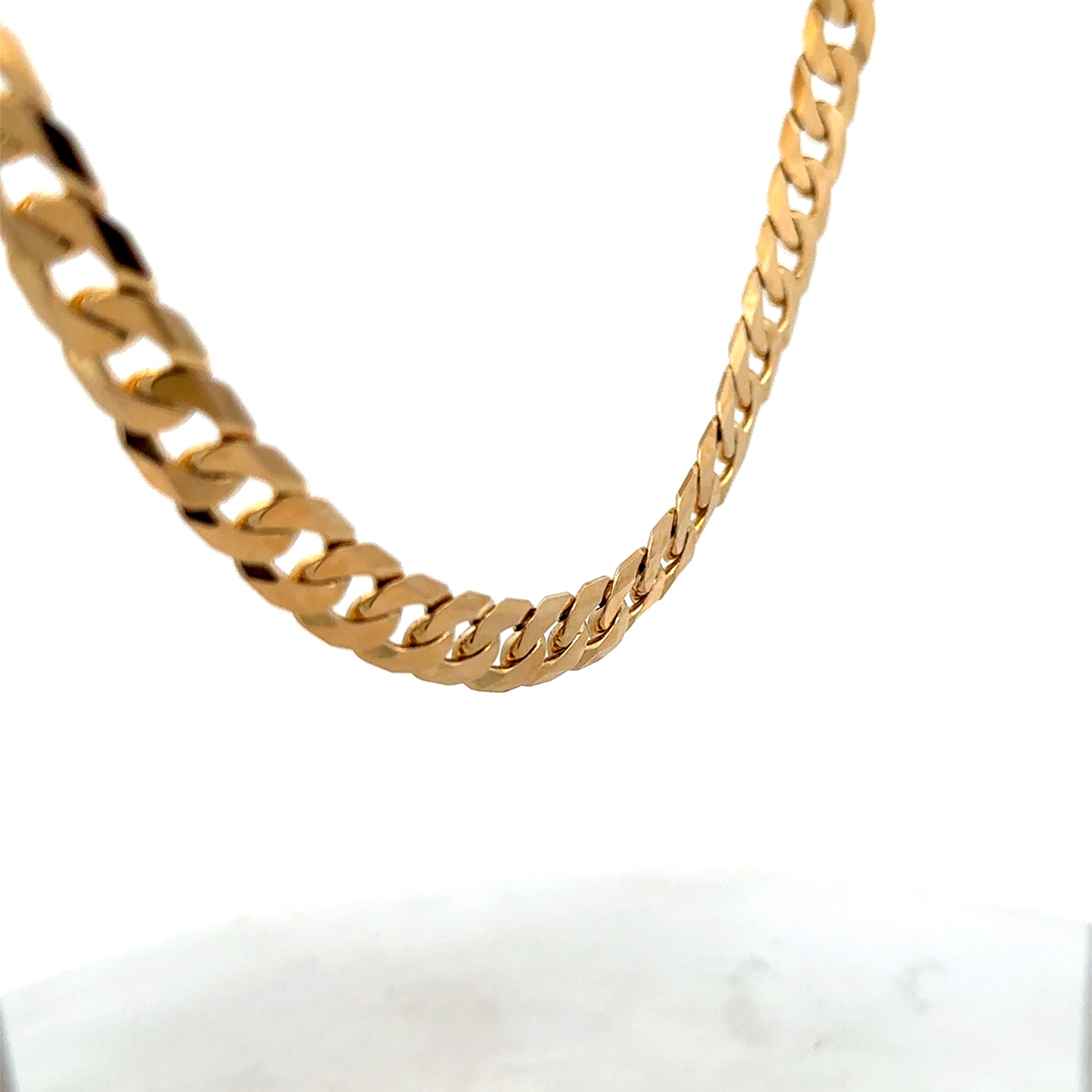 9ct yellow gold curb chain weighing 60.2g with a classic link design, crafted by Reeves and Sons.