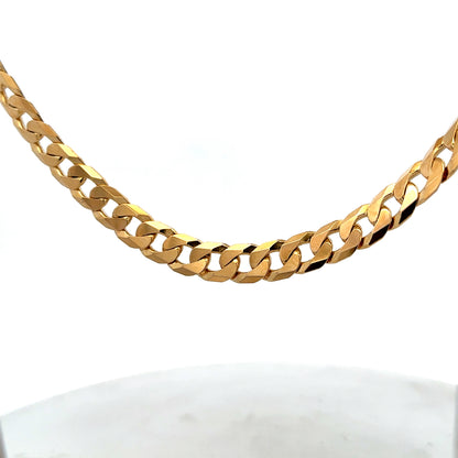 9ct yellow gold curb chain with a sturdy link design, weighing 60.2g, by Reeves and Sons.