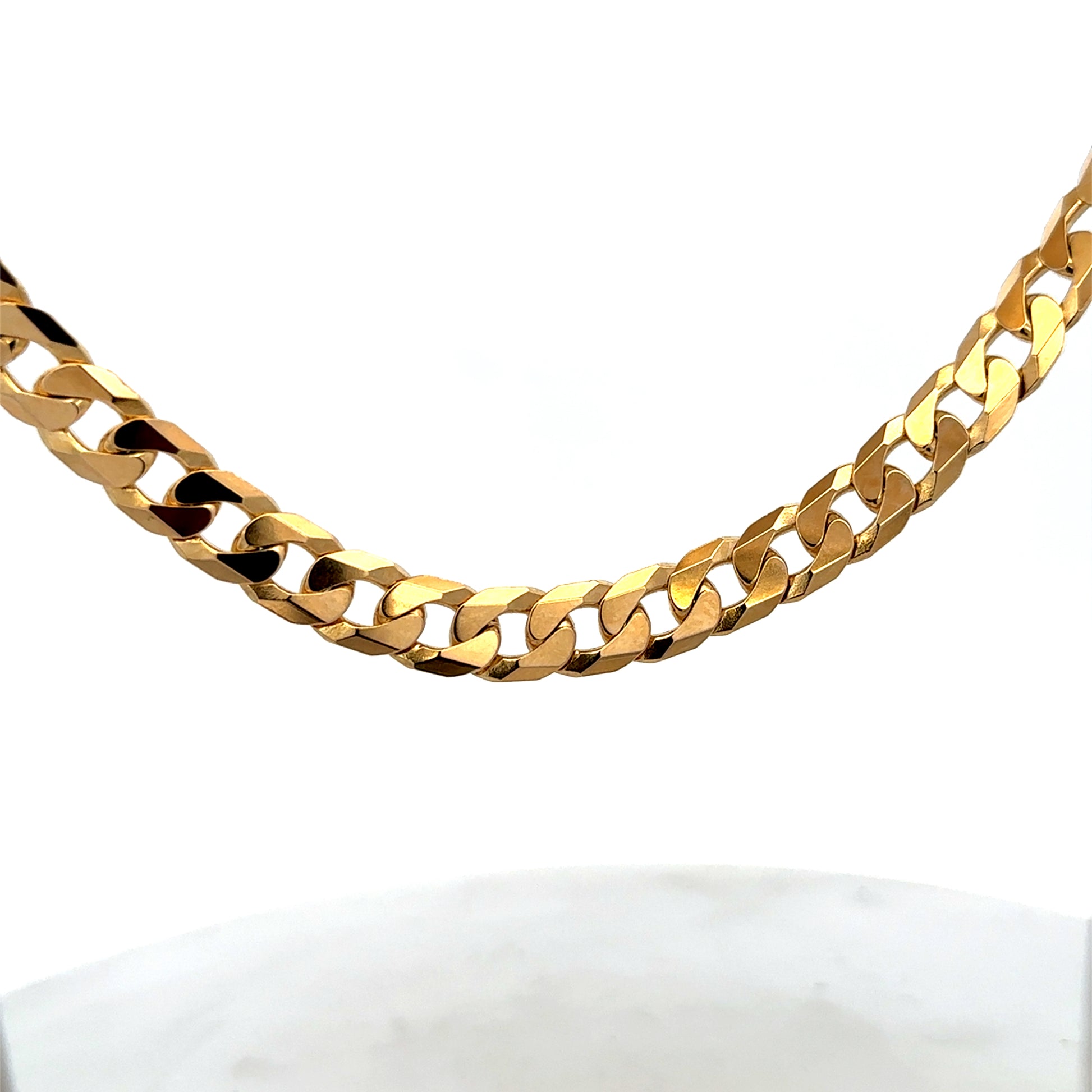 9ct yellow gold curb chain with a sturdy link design, weighing 60.2g, from Reeves and Sons.