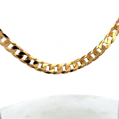 9ct yellow gold curb chain with a sturdy link design, weighing 60.2g, from Reeves and Sons.