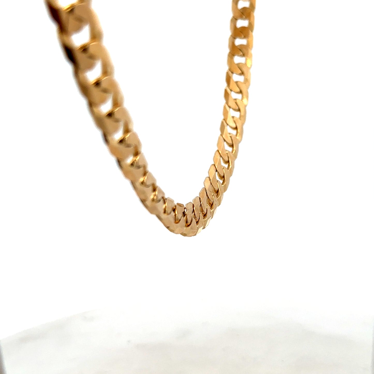 9ct yellow gold curb chain weighing 60.2g with detailed links, crafted by Reeves and Sons.