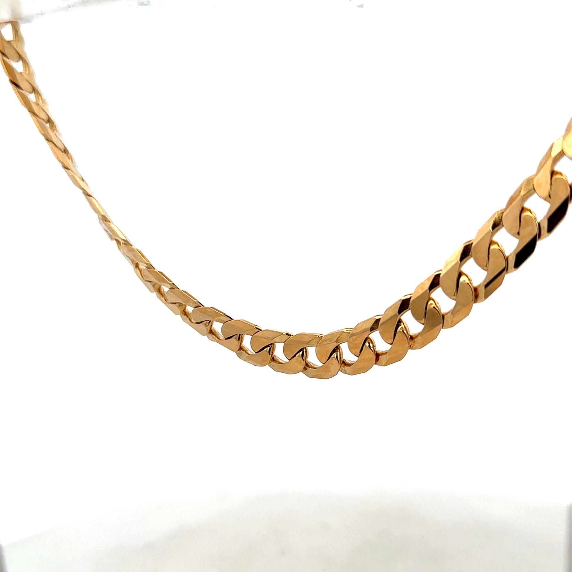 9ct yellow gold curb chain weighing 60.2g, crafted by Reeves and Sons, with a close-up view of the chain links.