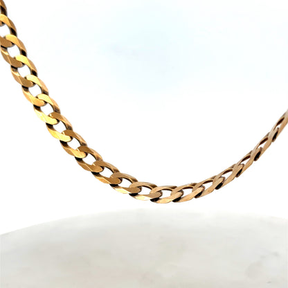 9ct yellow gold curb chain from Reeves and Sons, weighing 30.1g, with a detailed close-up of the polished chain links.