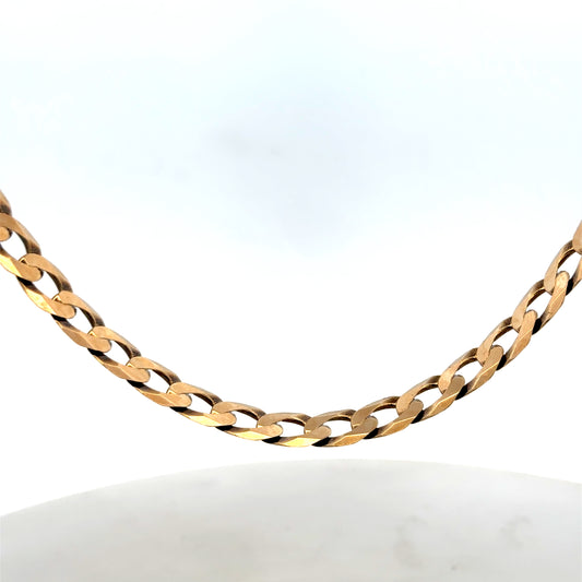 9ct yellow gold curb chain weighing 30.1g, shiny jewelry chain from Reeves and Sons, detailed close-up of chain links.