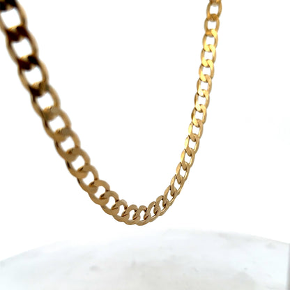 9ct yellow gold curb chain with a polished finish, weighing 27.7g, showcasing its sturdy links and classic design.
