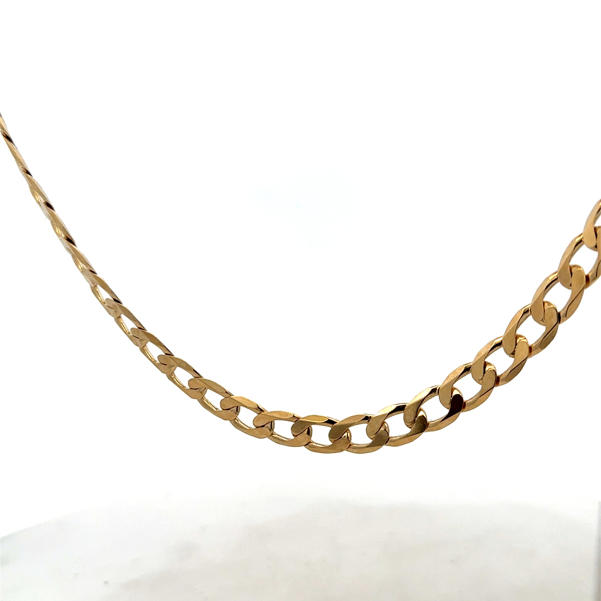 9ct yellow gold curb chain weighing 27.7g, featuring classic interlinked design, crafted by Reeves and Sons.