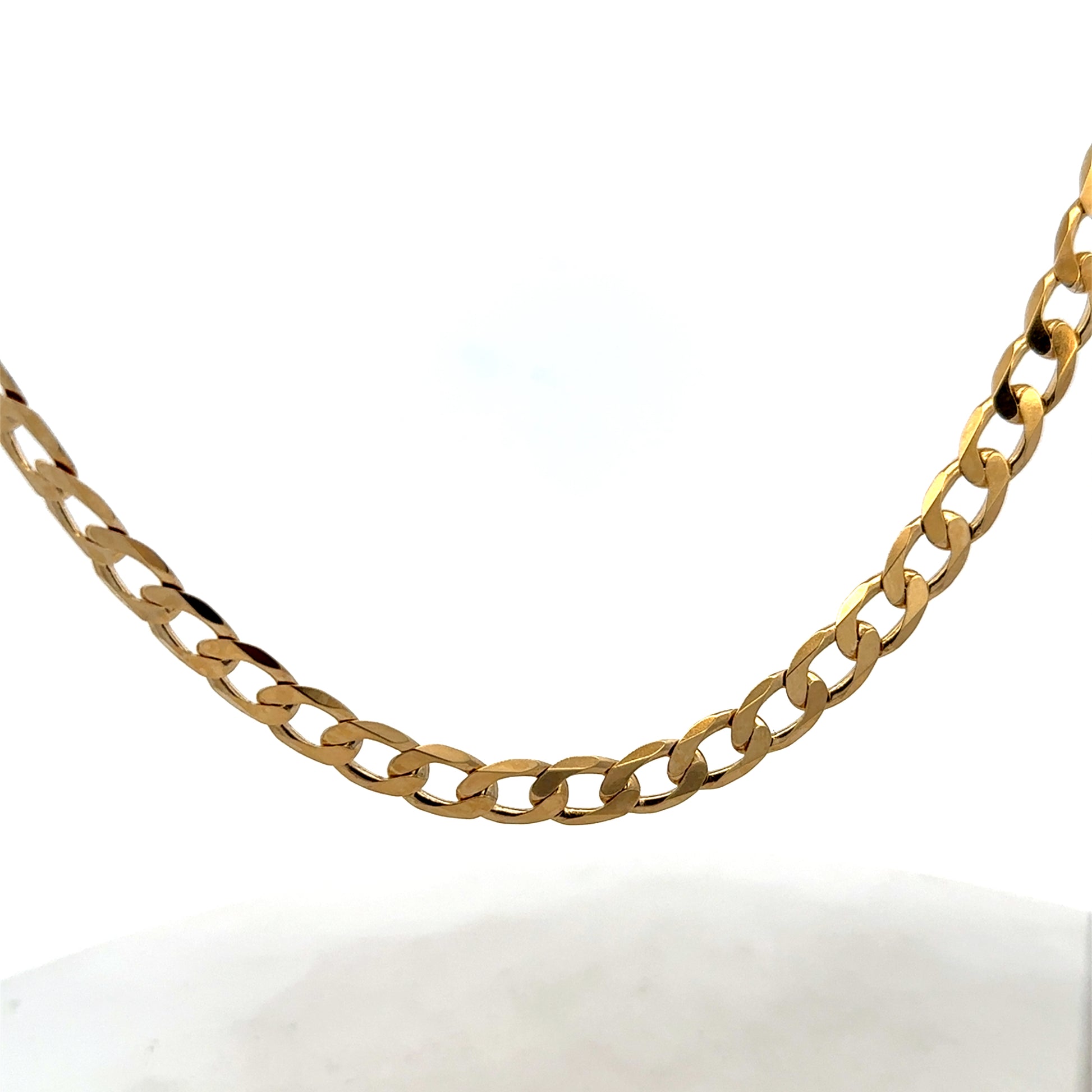 Reeves and Sons 9ct yellow gold curb chain with a polished finish, weighing 27.7g, displayed on a neutral background.