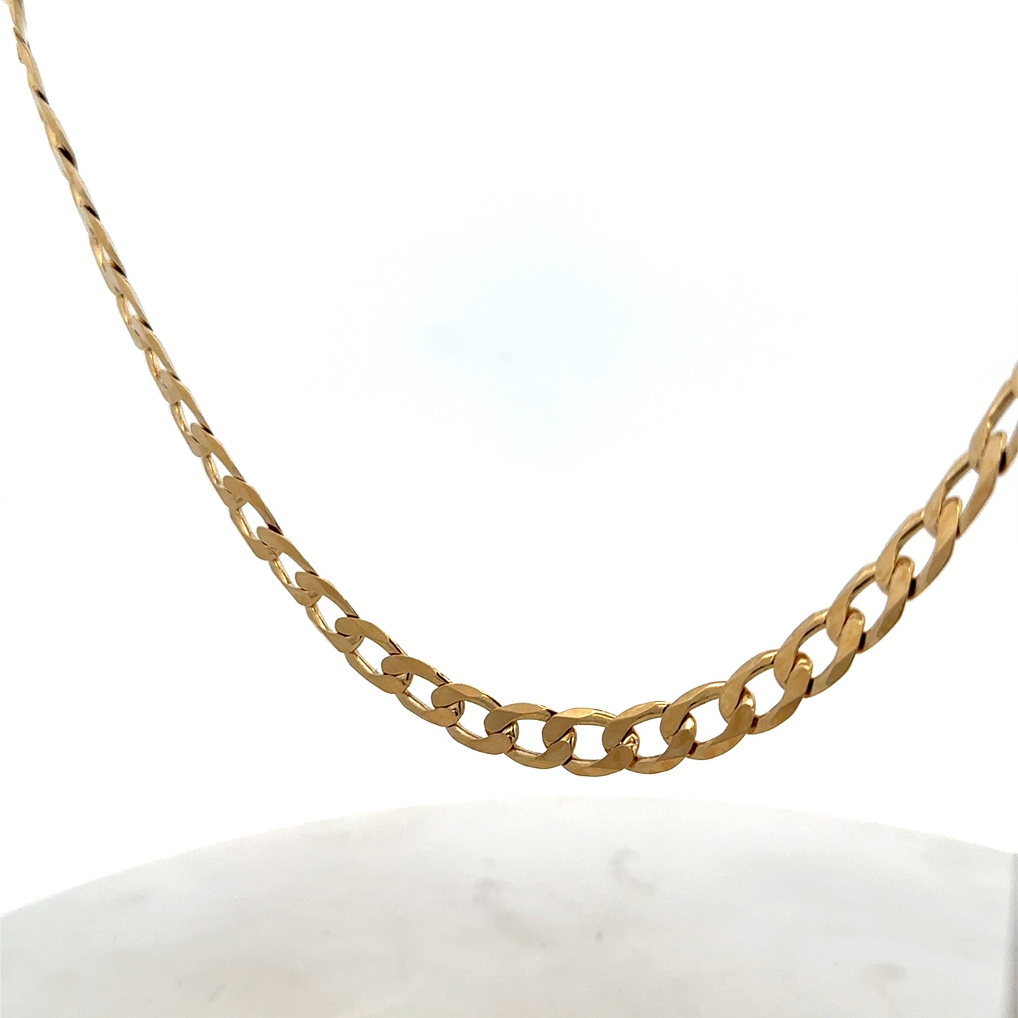 Reeves and Sons 9ct yellow gold curb chain with a 27.7g weight, showcasing a polished gold link design.