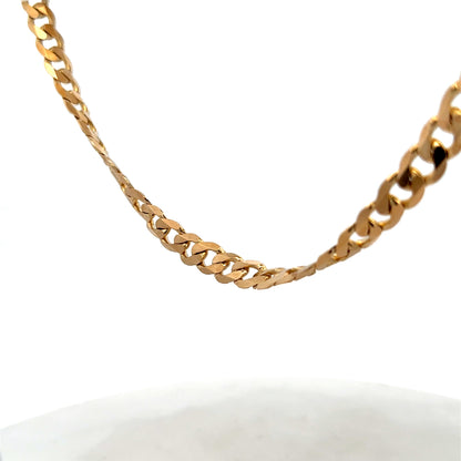 Reeves and Sons 9ct yellow gold curb chain, 44.3g, featuring a classic linked design with polished finish.
