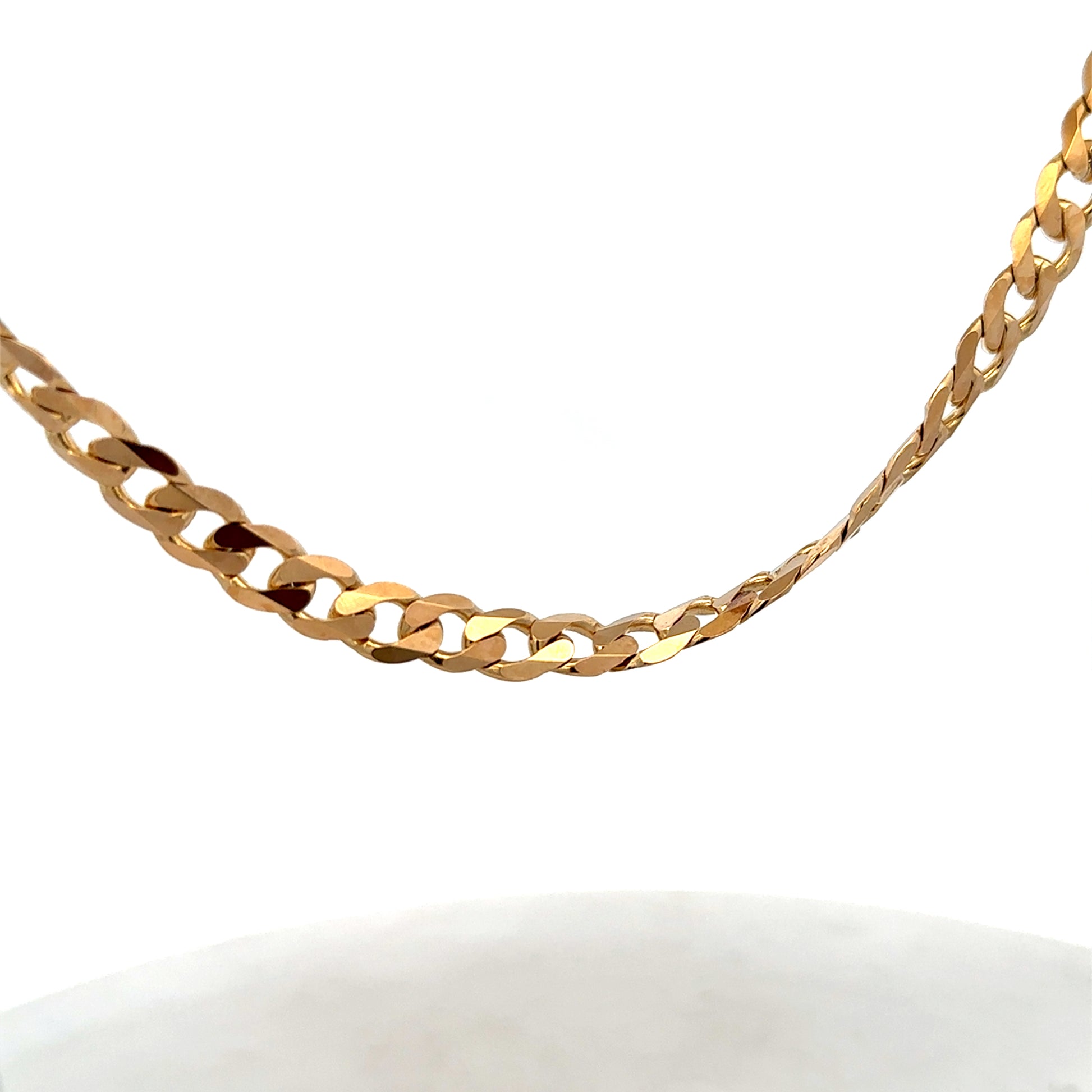 9ct yellow gold curb chain weighing 44.3g, featuring classic linked design from Reeves and Sons.