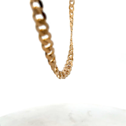 9ct yellow gold curb chain with a secure clasp, weighing 44.3g, from Reeves and Sons, displayed against a neutral background.
