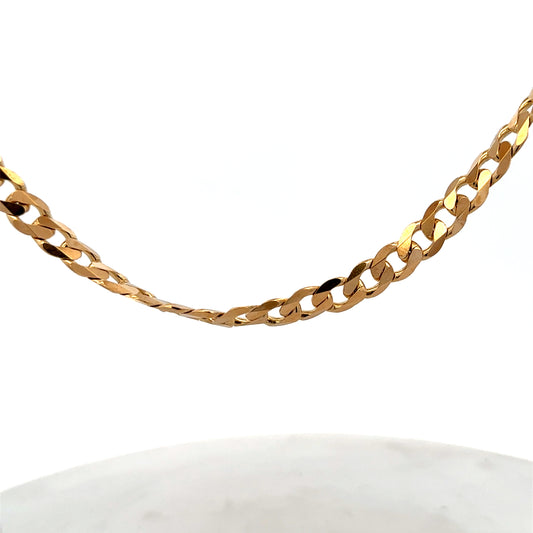 9ct yellow gold curb chain with a sturdy link design, weighing 44.3g, made by Reeves and Sons.