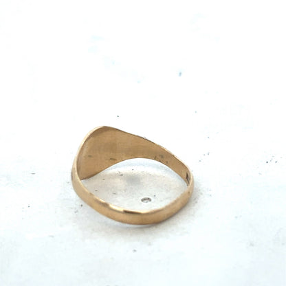 9ct yellow gold signet ring in size M with Reeves and Sons branding, featuring a smooth polished surface and classic design.