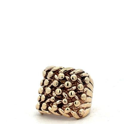 9ct yellow gold keeper ring in size P1/2 with a smooth band, crafted by Reeves and Sons.