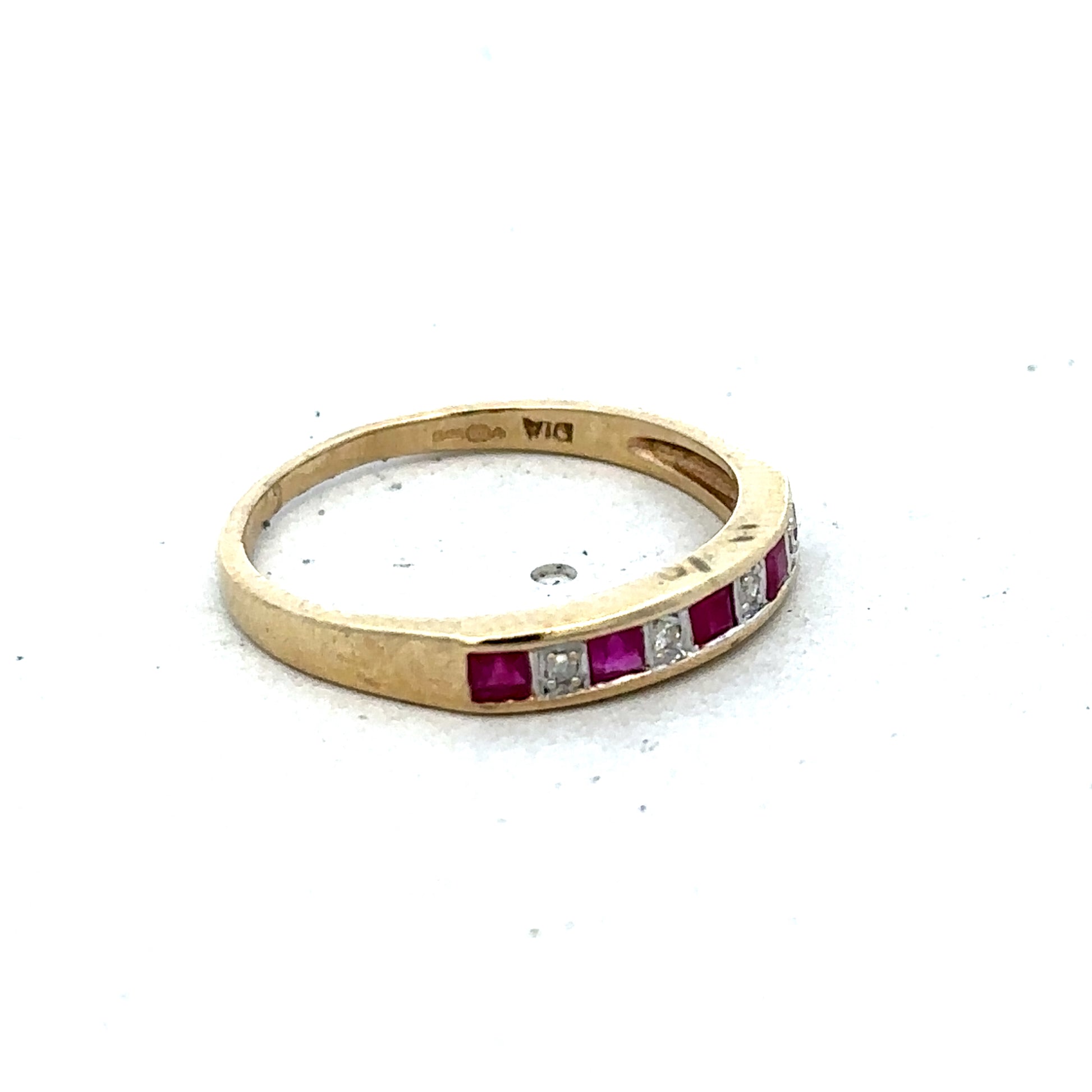 9ct yellow gold ruby and diamond ring, size K1/2, featuring a central ruby and surrounding diamonds, by Reeves and Sons.