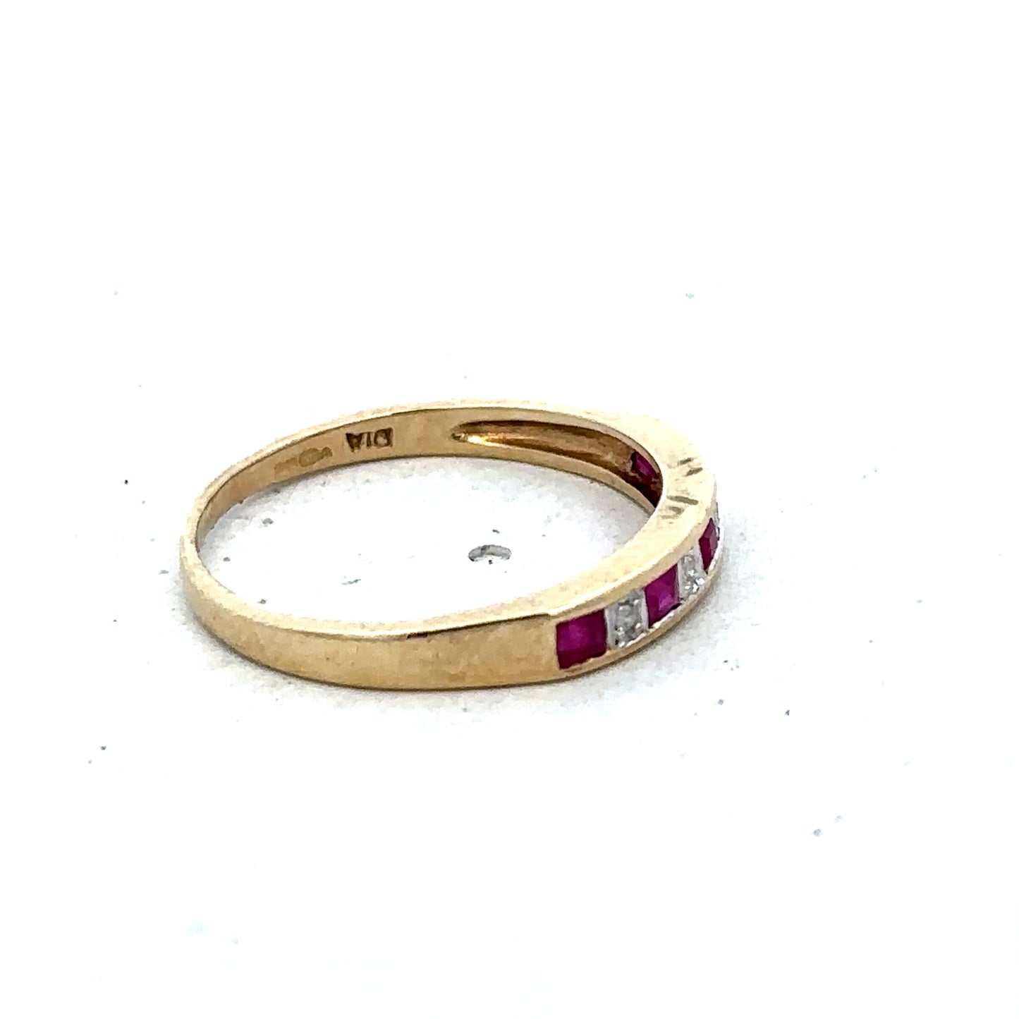 9ct yellow gold ruby and diamond ring in size K1/2, featuring a central ruby and diamond accents by Reeves and Sons.