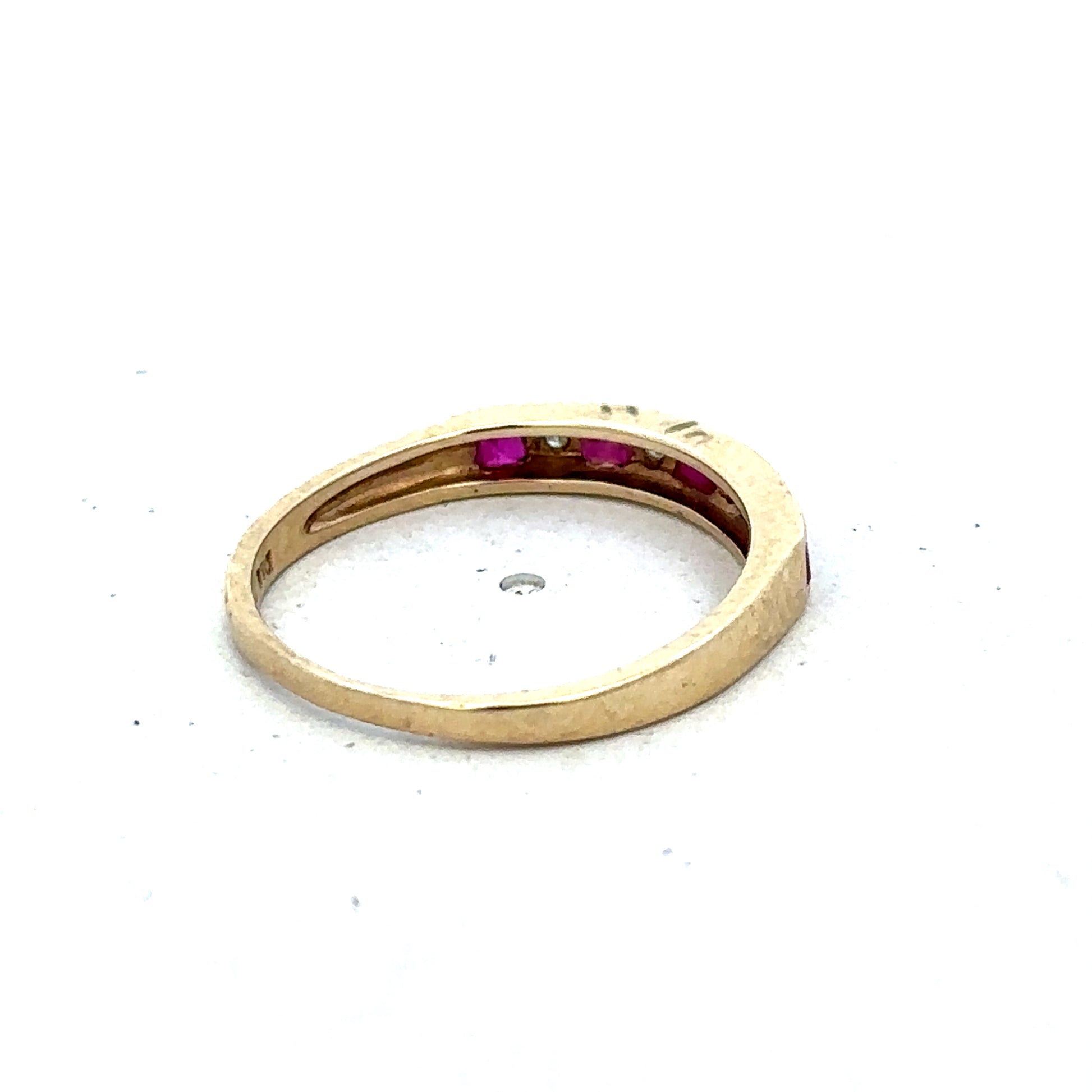 9ct yellow gold ruby and diamond ring with intricate design, size K1/2, by Reeves and Sons, shown on a white background.