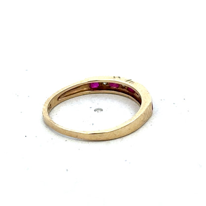 9ct yellow gold ruby and diamond ring with intricate design, size K1/2, by Reeves and Sons, shown on a white background.