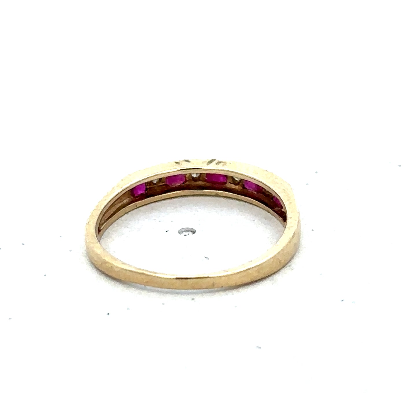 9ct yellow gold ruby and diamond ring, size K1/2, featuring a central ruby and sparkling diamonds, crafted by Reeves and Sons.