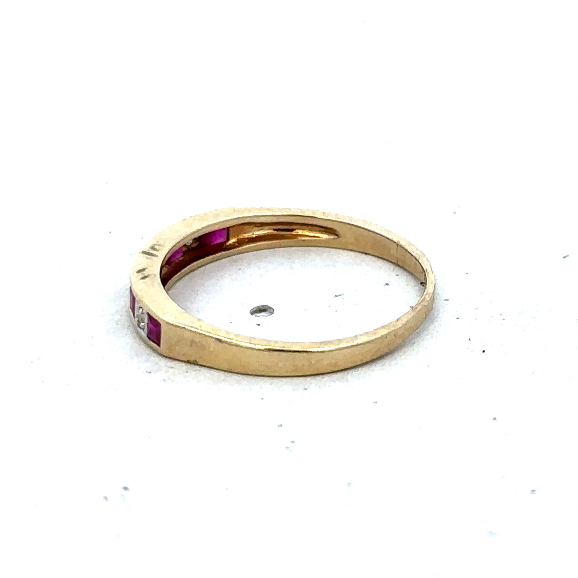 9ct yellow gold ruby and diamond ring, size K½, featuring a central ruby and sparkling diamonds, by Reeves and Sons.