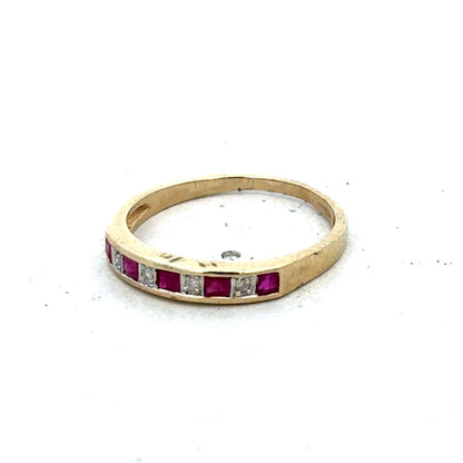 9ct yellow gold ruby and diamond ring, size K1/2, featuring a vibrant ruby and sparkling diamonds, crafted by Reeves and Sons.