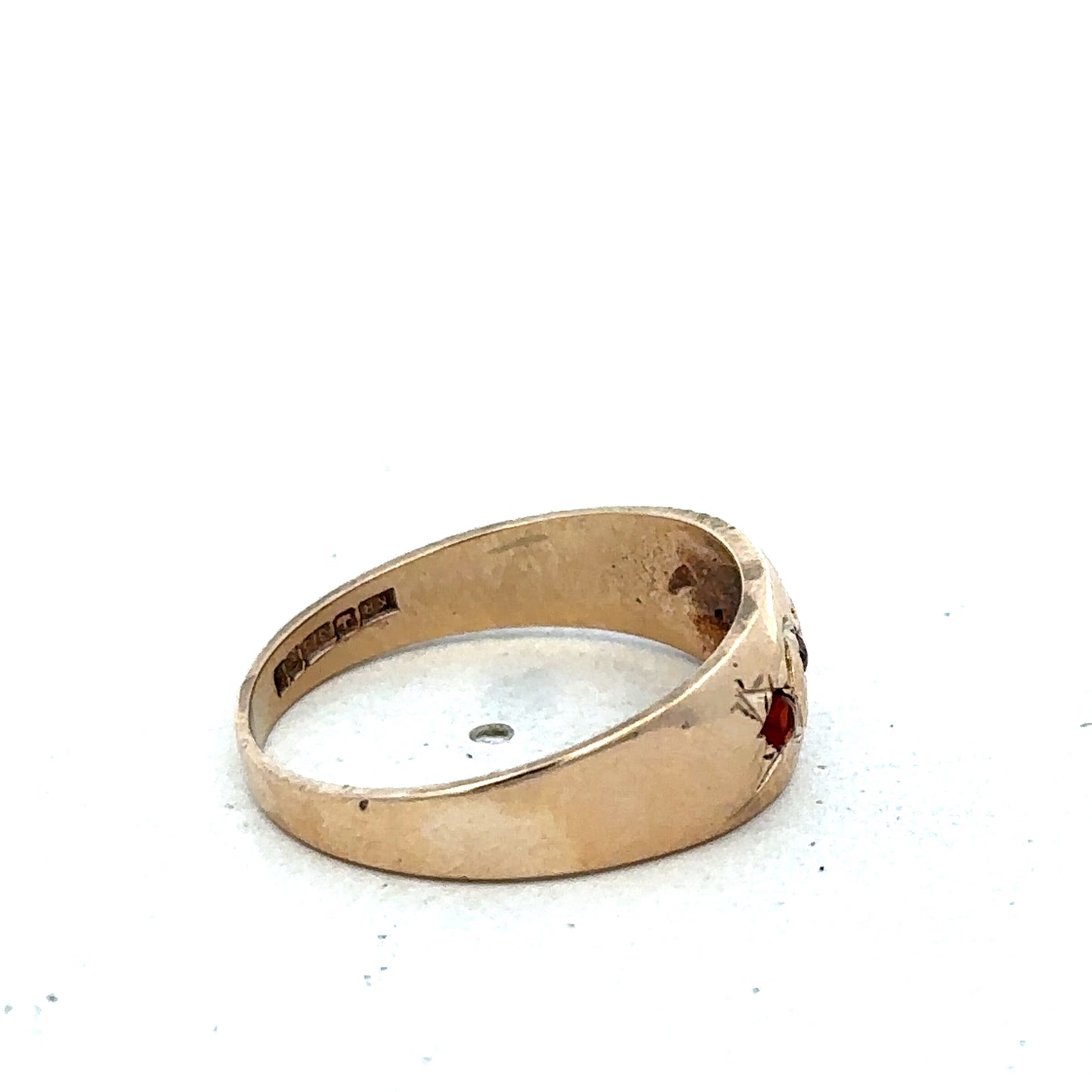 9ct yellow gold garnet ring in size N with a polished finish, featuring a central garnet gemstone and intricate band details.