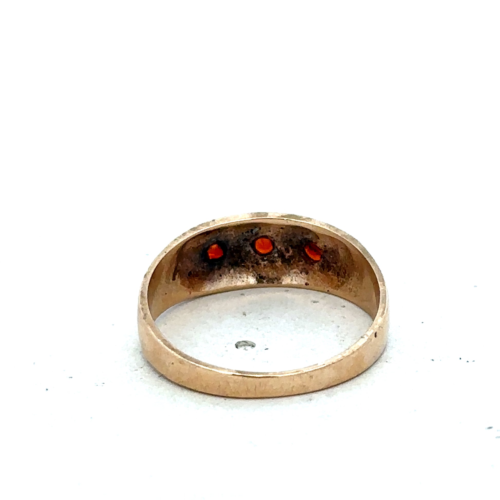 9ct yellow gold garnet ring size N by Reeves and Sons with a polished gemstone and elegant band design