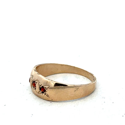 9ct yellow gold garnet ring in size N with a polished band, featuring a deep red garnet gemstone set at the center.