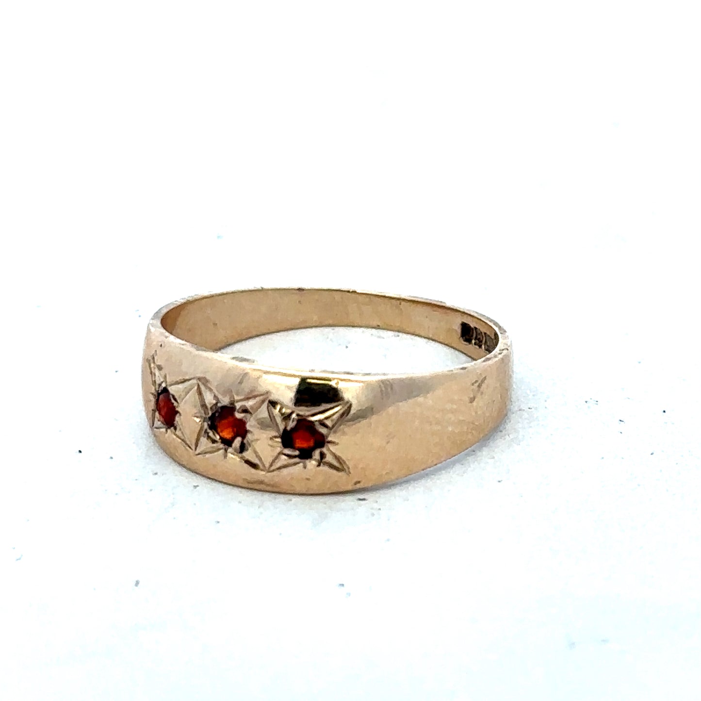 9ct yellow gold garnet ring in size N with a polished finish, featuring a deep red garnet gemstone set in a classic band.
