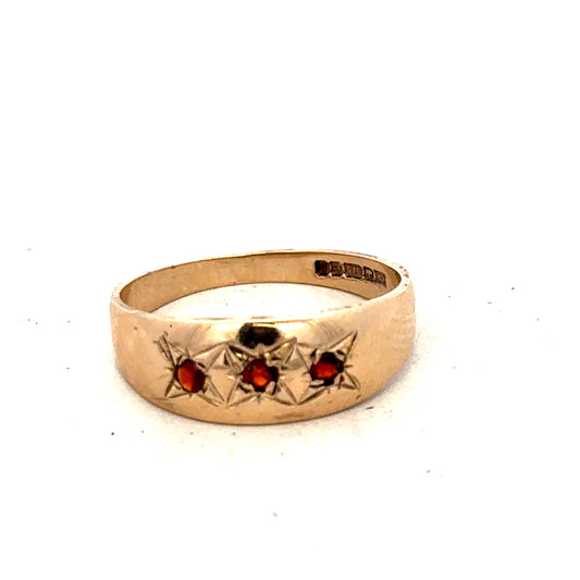 9ct yellow gold garnet ring in size N featuring a vibrant red garnet gemstone, crafted by Reeves and Sons.