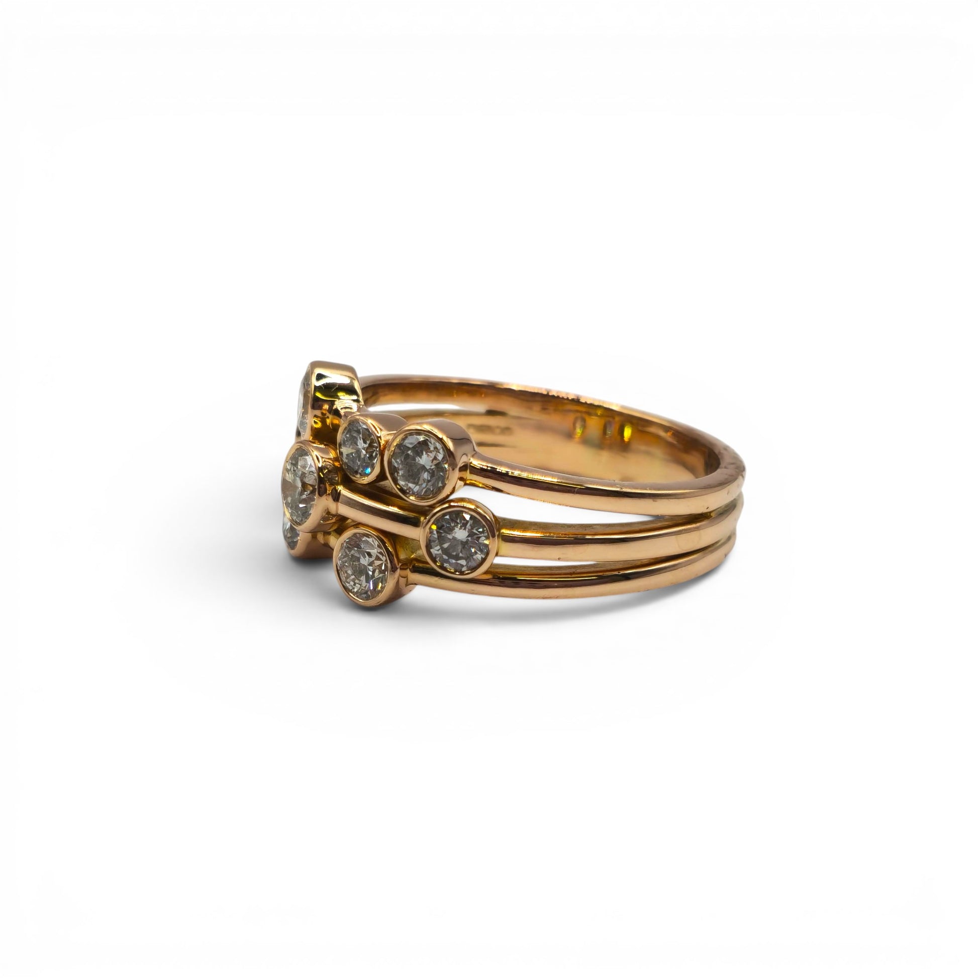 18ct rose gold diamond bubble ring by Reeves and Sons, featuring a delicate design with sparkling diamonds on a polished band.