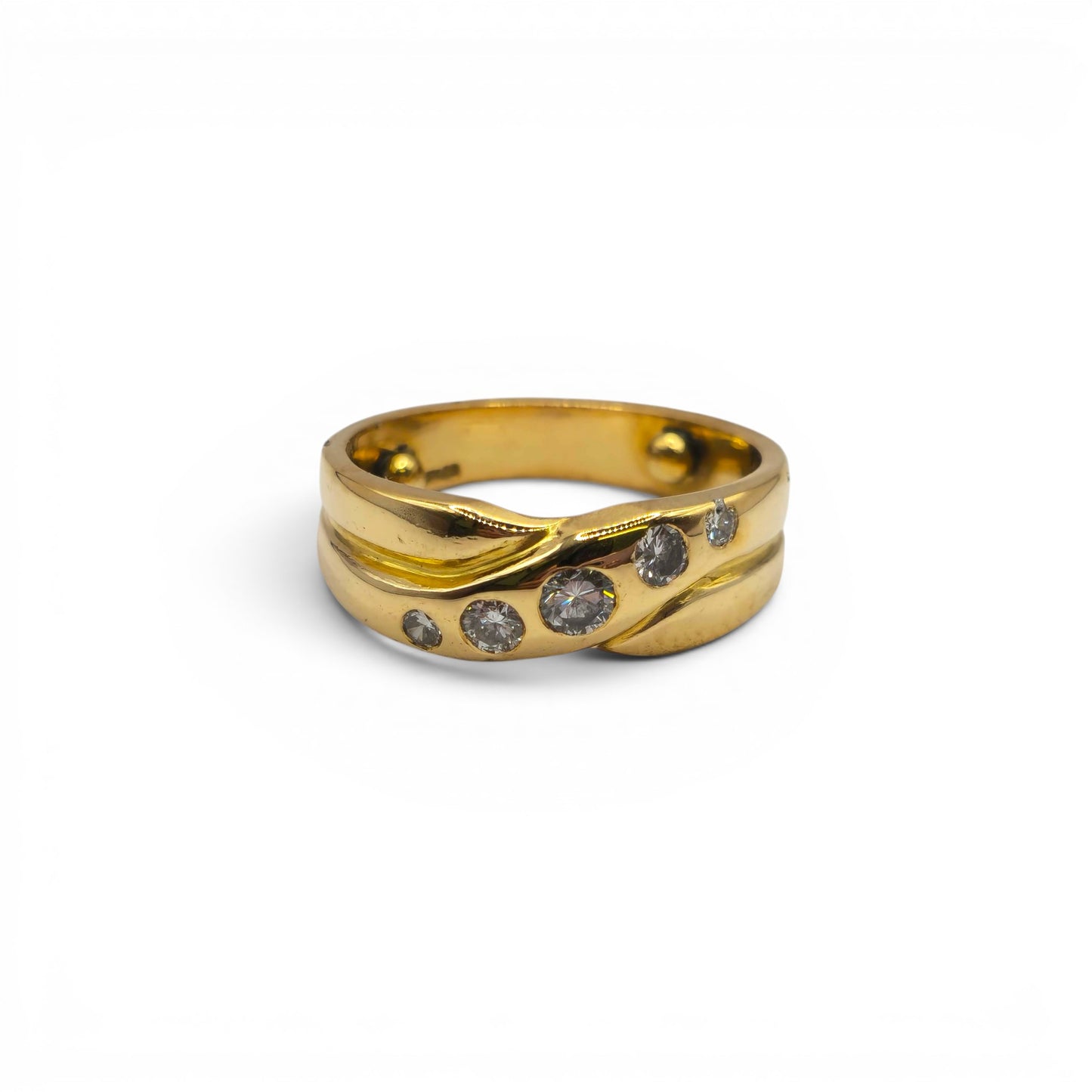 18ct yellow gold diamond crossover ring by Reeves and Sons, showcasing a stylish design with sparkling diamonds on a sleek band.